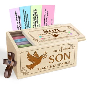 May include: A wooden box set with Bible verses for a son. The box has a dove and olive branch design, with the words "Son, Peace & Guidance." The box contains colorful cards with Bible verses. A wooden cross is on the side.
