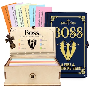 May include: A wooden box with the text "Boss, Read Me Whenever You..." and a navy blue book with gold lettering. The box contains colourful cards and a cross-shaped charm. The book reads "Bible Verse".