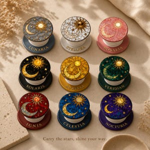 May include: Nine celestial-themed phone grips with unique designs featuring moons, suns, and stars. Each grip has a different color scheme and name, including "Lunaria," "Stellara," and "Nocturia." The text "Carry the stars, shine your way" is at the bottom.