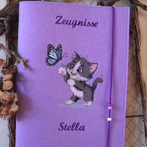 May include: A set of three ceramic mugs with a speckled, matte finish in cream, light grey, and dark grey. Each mug has a simple, minimalist design and a rounded handle.