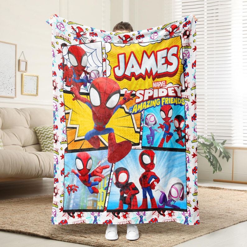 May include: A white blanket featuring a comic book style design with the text "JAMES" and "SPIDEY AND HIS AMAZING FRIENDS". The blanket showcases various images of Spider-Man in action poses, with a repeating pattern of Spider-Man figures around the border.