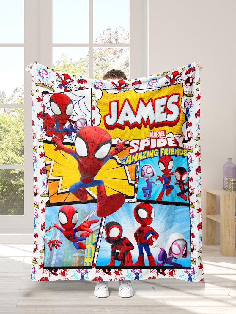 May include: A white blanket featuring a comic book style design with the text "JAMES" and "MARVEL SPIDEY AND HIS AMAZING FRIENDS". The blanket showcases various illustrations of Spider-Man and other characters in vibrant colors.