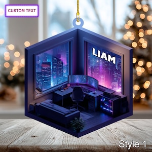 May include: A blue, cube-shaped ornament featuring a computer setup with a cityscape view. The ornament has the name "LIAM" and the text "CUSTOM TEXT" on it. The style is labeled "Style 1".