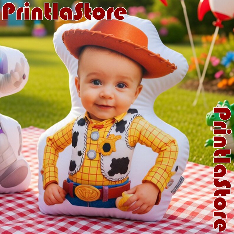 A plush toy of a baby dressed in a cowboy costume, including a hat and a plaid shirt, is sitting on a red and white checkered tablecloth.