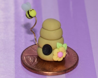 Miniature Bee Hive with Bumblebee and Yellow Flower