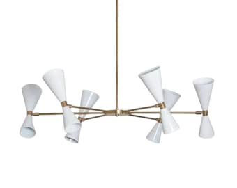 May include: A modern chandelier with eight white cone-shaped shades and brass-colored arms and central stem. The light fixtures are arranged in a starburst pattern, creating a stylish and contemporary lighting design. The fixture is suspended from a brass-colored ceiling mount.