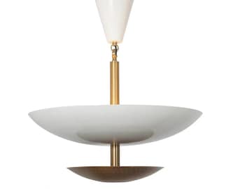May include: A modern white and brass pendant light fixture. The fixture features a white, cone-shaped top, a brass rod, and a large, white, bowl-shaped shade. A smaller, bronze-colored bowl is at the bottom.