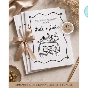 May include: A white wedding activity book with a black line drawing of a couple in a car, tied with a champagne-colored ribbon. The cover features the text "WEDDING ACTIVITY BOOK", "Kate + John", and a badge stating "70+ PAGES". The book is bound with holes.