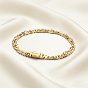 May include: A white ceramic mug with a black handle and the text "But First, Coffee" in a handwritten style. The mug is on a white surface. The mug is approximately 4 inches tall.