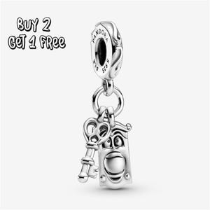 May include: A silver charm with a key and a door knocker design. The charm is suspended from a Pandora branded bead. The text "BUY 2 GET 1 FREE" is in the upper left corner.