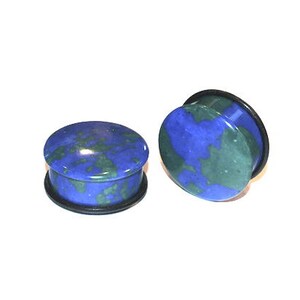 May include: A pair of blue and green stone ear gauges with black rubber o-rings.