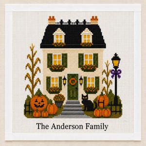 May include: A cross-stitch pattern featuring a two-storey house with a black roof, green shutters, and yellow windows. The scene includes pumpkins, corn stalks, a black cat, and a lamp post. The text The Anderson Family is printed at the bottom.
