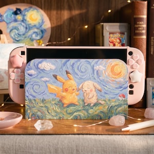 May include: A light pink gaming console dock featuring a textured, impressionist-style painting of Pikachu and a rabbit-like creature in a grassy field under a swirling sky with a bright sun. The dock is flanked by matching pink controllers with star-shaped buttons.