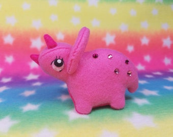 Fluffy Bottom Tessa Triceratops-kawaii hot pink dinosaur with swarovski crystal, 80s-inspired neon fluffy bottom plushie