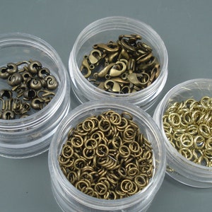 Mix of Brass Colored Crimps, Jump Rings and Various Lobster Claw Clasps