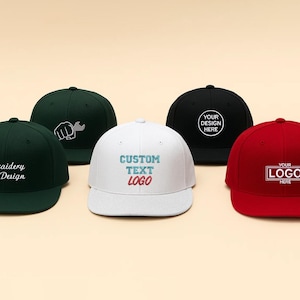 May include: Five baseball caps in various colors: dark green, white, black, and red. Each cap features custom text or a logo. The dark green caps have white embroidery. The white cap has blue and red text. The black and red caps have white logos.