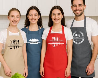 May include: Four people wearing aprons in a kitchen setting. The aprons are in various colors: tan, blue, red, and gray. Each apron has a white design with the words "CUSTOM TEXT". The aprons feature kitchen utensils and food-related graphics.