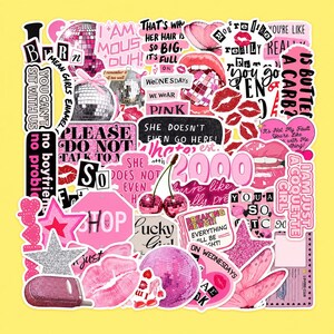 May include: A collection of assorted vinyl stickers featuring a pink and black color palette. Designs include disco balls, cherries, lips, stars, and various text quotes such as "You can't sit with us," "On Wednesdays we wear pink," and "Is butter a carb?"