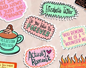 May include: A collection of colorful stickers with various phrases and illustrations. One sticker says "HEY SAY I'M BAD NEWS I JUST SAY, 'THANKS'". Another says "Elizabeth Taylor". Other stickers include "Do You Think its FOREVER" and "Actually Romantic".