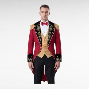 May include: A red tailcoat with black lapels featuring gold embroidery and fringe shoulder details, worn over a gold patterned waistcoat, white button-down shirt, red bow tie, and black trousers. The ensemble includes a gold chain across the waistcoat.