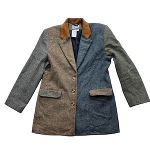 May include: A multi-colored blazer with a brown suede collar. The jacket is divided into sections of gray, brown, and blue tweed fabric. It has three gold buttons and two front pockets.