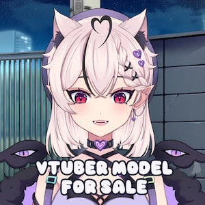 Puede incluir: Ilustración digital de un modelo VTuber con cabello rosa claro, orejas de gato y ojos rojos. El personaje lleva un collar negro con un colgante de corazón morado y un atuendo morado. El texto "VTUBER MODEL FOR SALE" se muestra en la parte inferior.