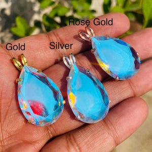 Minimalist teardrop Angel Aura Quartz necklace with shimmering rainbow finish in sterling silver setting. Handmade crystal jewelry ideal for birthday, anniversary, or spiritual gift.