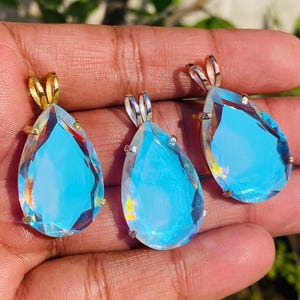 Teardrop Angel Aura Quartz pendant necklace in 925 sterling silver, featuring an iridescent rainbow crystal with delicate shimmer. Elegant spiritual jewelry gift for women and crystal lovers.