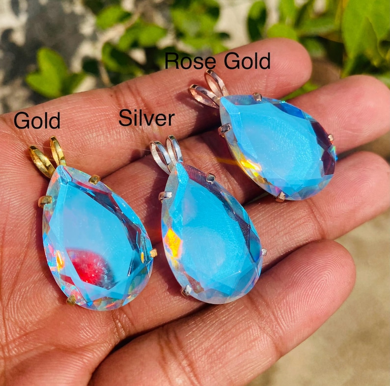 Minimalist teardrop Angel Aura Quartz necklace with shimmering rainbow finish in sterling silver setting. Handmade crystal jewelry ideal for birthday, anniversary, or spiritual gift.