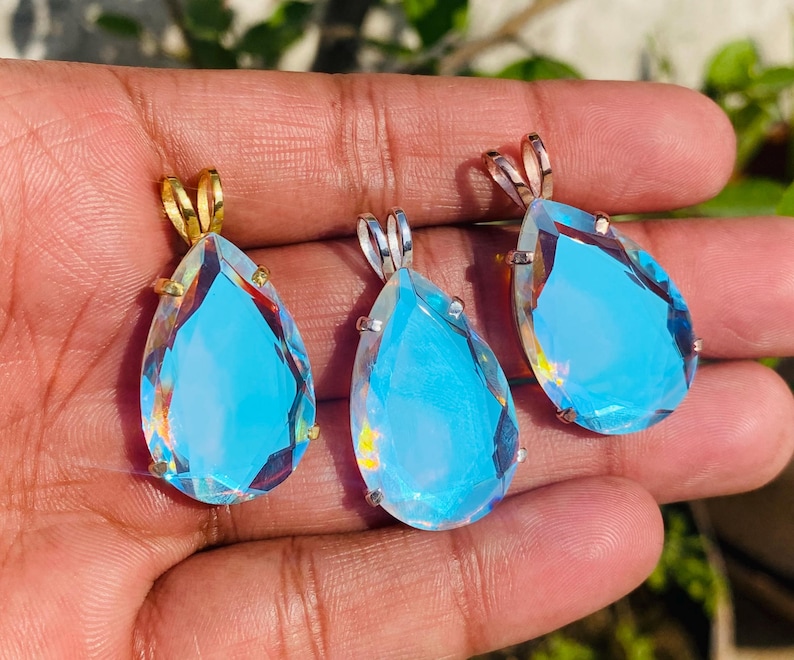 Teardrop Angel Aura Quartz pendant necklace in 925 sterling silver, featuring an iridescent rainbow crystal with delicate shimmer. Elegant spiritual jewelry gift for women and crystal lovers.
