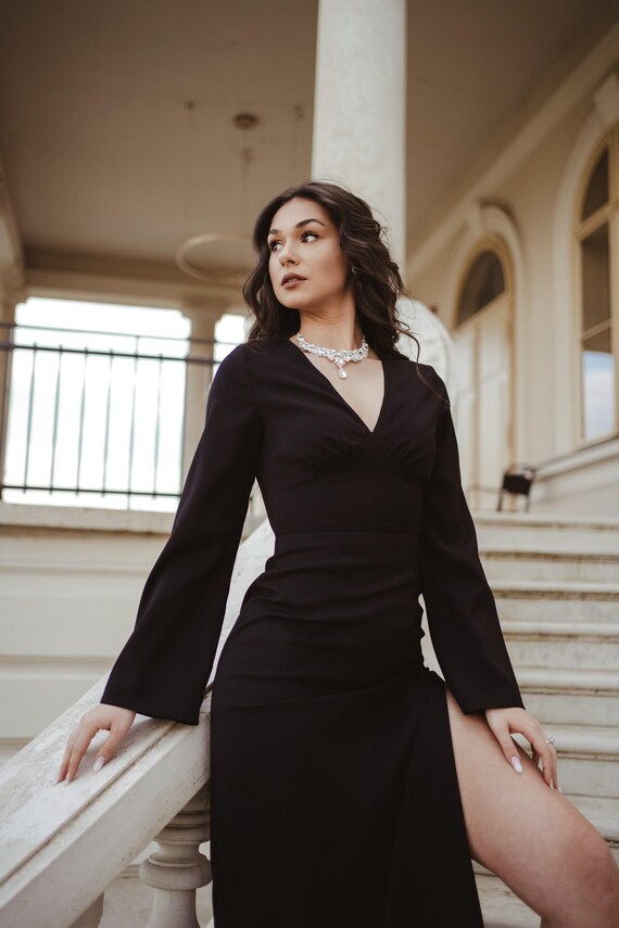 black maxi dress bell sleeves V Neck Black V-neck Elegant Maxi Dress With Slit And Web Collection: Day Dresses This garment fits true Cotton Candy LA Devin Size/Medium:11