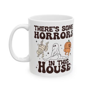 Theres Some Horrors In This House (HALLOWEEN &#39;&#39;25&#39;&#39;) - Ceramic Mug
