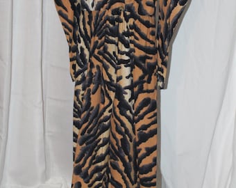 Vintage 80s tiger print jumpsuit striped cat one piece padded pleated shoulder plunge wrap front puff tapered sleeves and legs nip waist