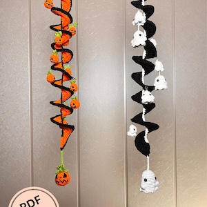 May include: Two crochet Halloween decorations hang vertically. One features orange spirals with black trim and small pumpkin accents. The other has black spirals with white ghost accents. The image includes a PDF pattern graphic.