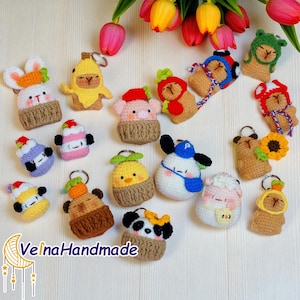 May include: A collection of colorful, handmade crochet keychains in various animal designs, including a bunny, pig, bear, and panda. Each keychain features a metal ring and is set against a white background with flowers. The text "Velna Handmade" is visible.