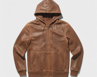 May include: Brown leather hooded jacket with a full-length zipper and a kangaroo pocket. The jacket has a drawstring hood and ribbed cuffs and hem. The leather has a distressed appearance.
