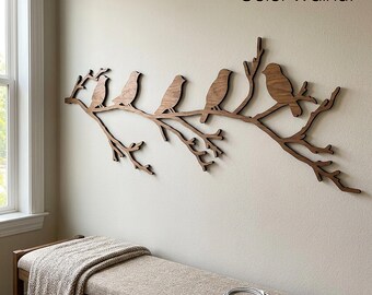 May include: A wall-mounted walnut-colored wooden cutout featuring five birds perched on a branching tree limb. The dark brown wood grain is visible on the silhouettes of the birds and the textured branches. The text Color Walnut is visible.
