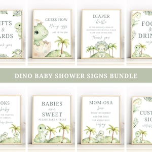 May include: A set of eight rectangular signs featuring watercolor illustrations of green dinosaurs and palm trees. The signs include text for a baby shower, such as Gifts & Cards, Guess How Many Eggs, Diaper Raffle, Food & Drinks, Books for Baby, Babies are Sweet, Mom-osa Bar, and Custom Sign.