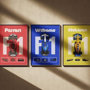 May include: Three framed prints featuring Formula 1 race cars. Each print has a different color background: red for Ferrari, blue for Williams, and yellow for McLaren. Each print includes the team name, the number 1, and an image of the car.
