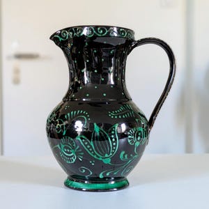 May include: A set of three ceramic nesting bowls in shades of blue, green, and white. The bowls have a speckled glaze and a simple design. The largest bowl is approx. 15 cm in diameter.