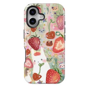 May include: A phone case featuring a whimsical design with strawberries, cherries, and a white cat. The case has a colorful pattern with cartoon-style illustrations of flowers, stars, and small animal faces. The case has a camera cutout.