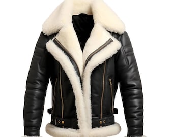 May include: Black leather jacket with a cream-colored shearling lining and collar. The jacket features a zip closure, multiple pockets, and a buckled belt at the waist. The sleeves have shearling cuffs.