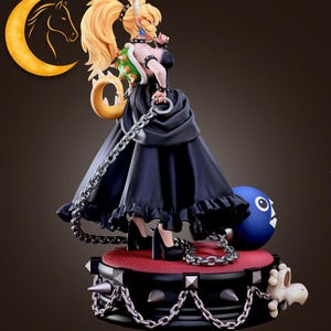 May include: A detailed figurine of a character with blonde hair, wearing a black dress and high heels. The figure is holding a chain and is standing on a platform with spikes. A blue ball with a face is also present.