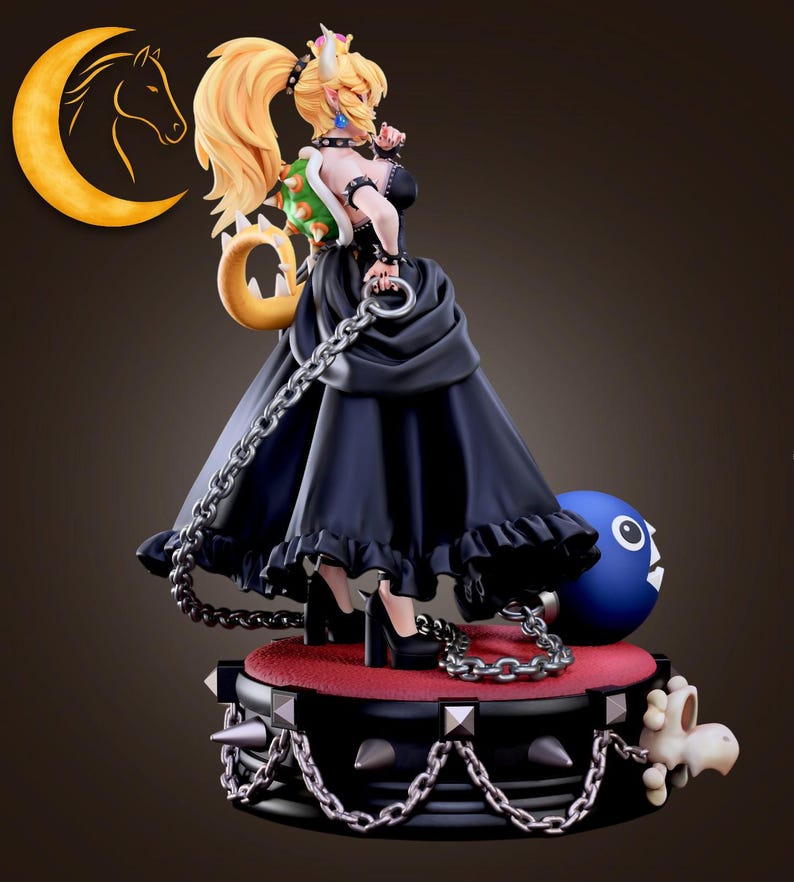 May include: A detailed figurine of a character with blonde hair, wearing a black dress and high heels. The figure is holding a chain and is standing on a platform with spikes. A blue ball with a face is also present.