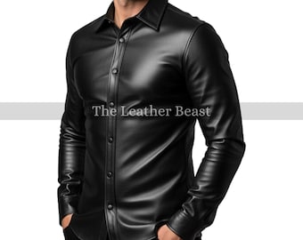 May include: Black leather button-down shirt with a classic collar. The shirt has long sleeves and is buttoned up the front. The text "The Leather Beast" is printed on the shirt.
