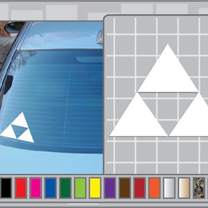 May include: A white triangular symbol with three overlapping triangles, commonly known as the Triforce, is displayed on the rear window of a car. The symbol is a popular design element in video games and pop culture.