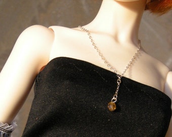 Delicate Doll necklace on silver chain