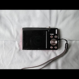 Vintage Nikon Coolpix S205: 12MP Digital Camera, 3x Zoom - Retro Y2K