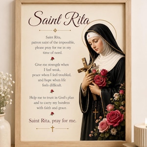 May include: A framed wall art print featuring an illustration of Saint Rita in a black habit, holding a wooden crucifix and red roses. The text reads: Saint Rita, patron saint of the impossible, please pray for me in my time of need.