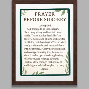 May include: A framed print with the text "PRAYER BEFORE SURGERY". The text is surrounded by a green border and leaf accents. The frame is a dark brown color. The prayer is written in a clear, easy-to-read font.
